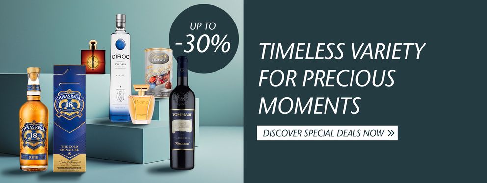 The advertisement showcases a selection of products such as champagne, whisky, perfume, and chocolates, perfect for special moments. With discounts of up to 30%, it invites customers to explore the offers.